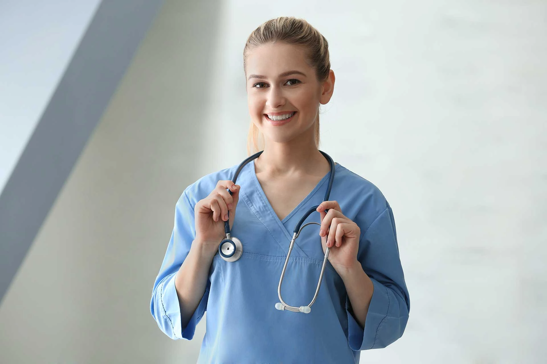 General medicine services in 3071 Perry Ave, Bronx, NY 10467 — a smiling female doctor with a stethoscope, ready to provide expert care.